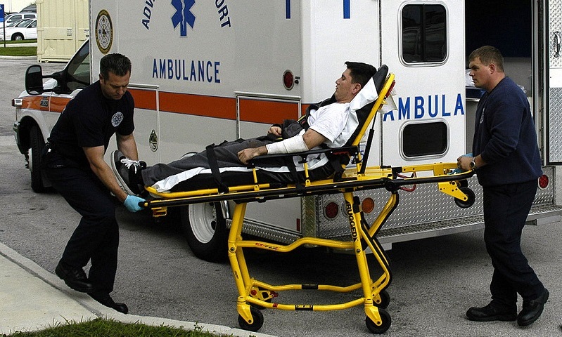 photograph of navy paramedics moving patient