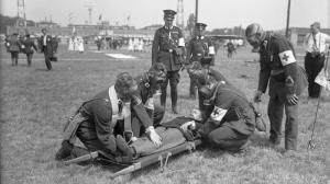 archival photograph of medics working on patient