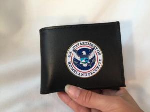 DHS ICE Bifold Wallet has a full-color metal medallion on the front.